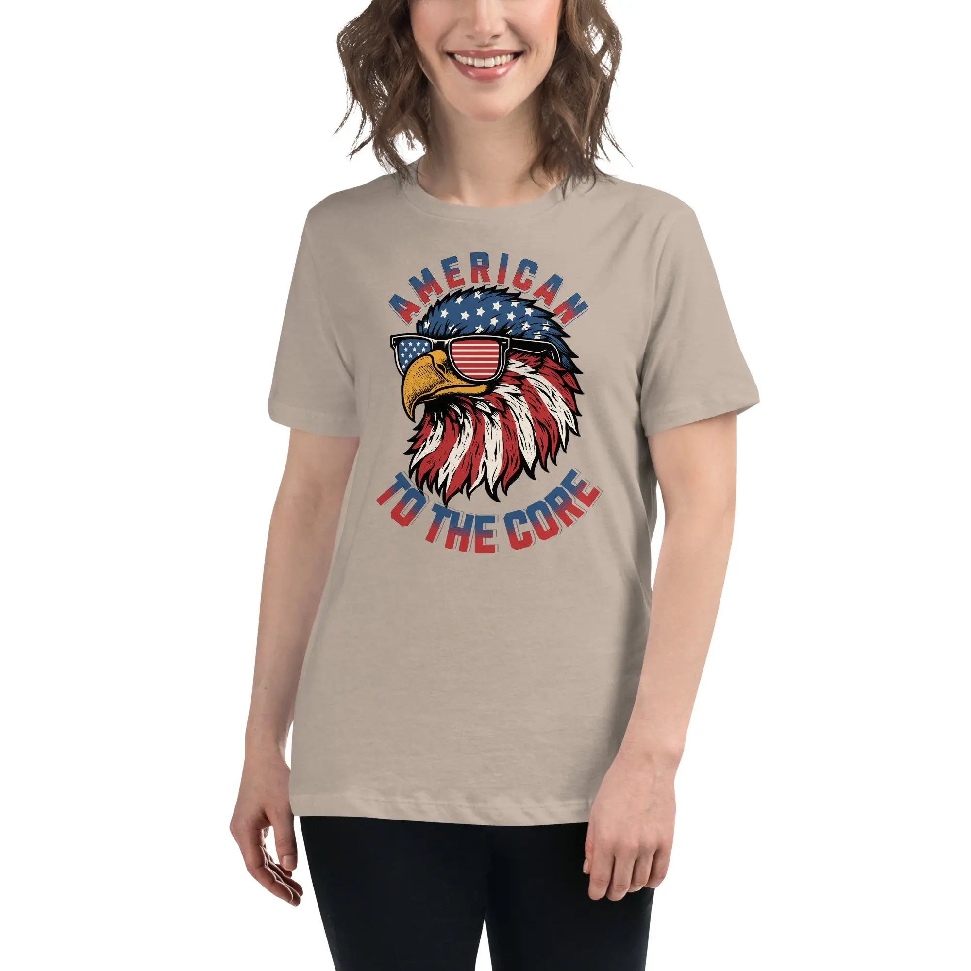 Back of woman wearing a heather stone patriotic t-shirt with an eagle head and  "American To The Core" text