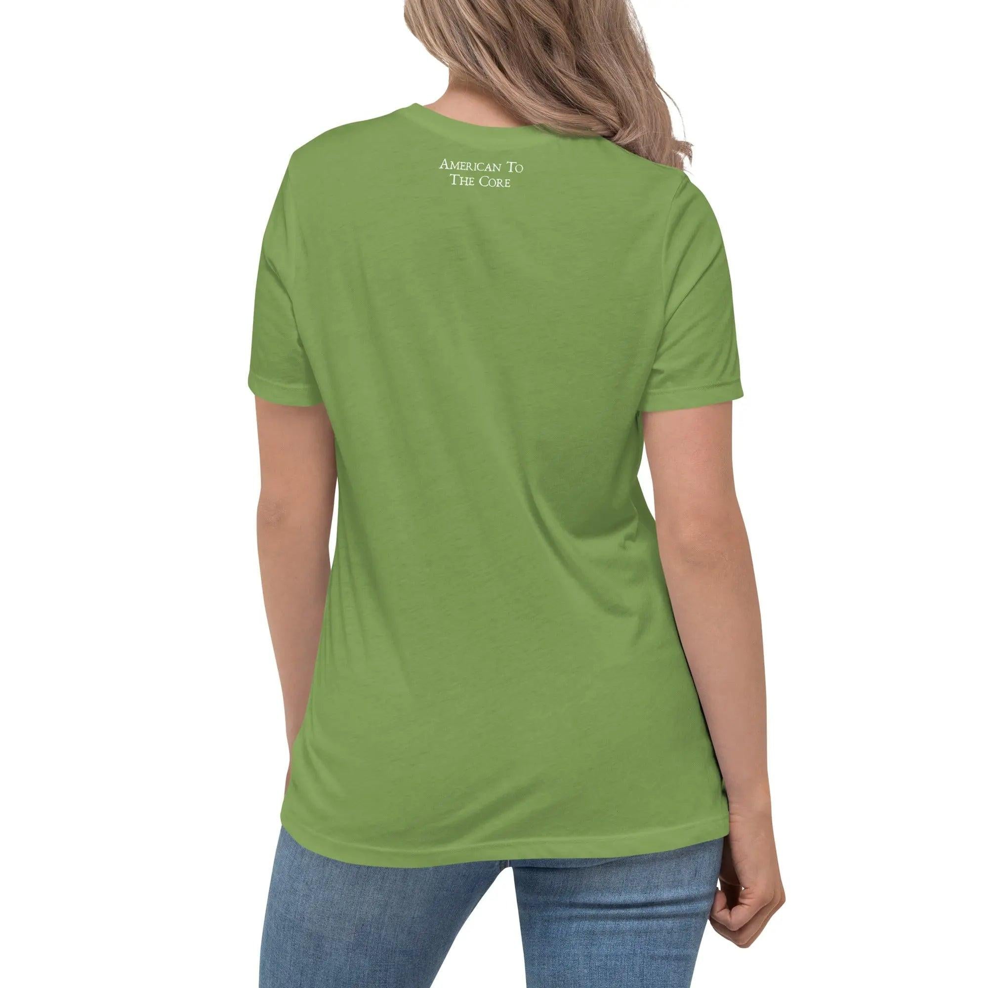 Back of a woman wearing a leaf green patriotic t-shirt with the text "American To The Core."