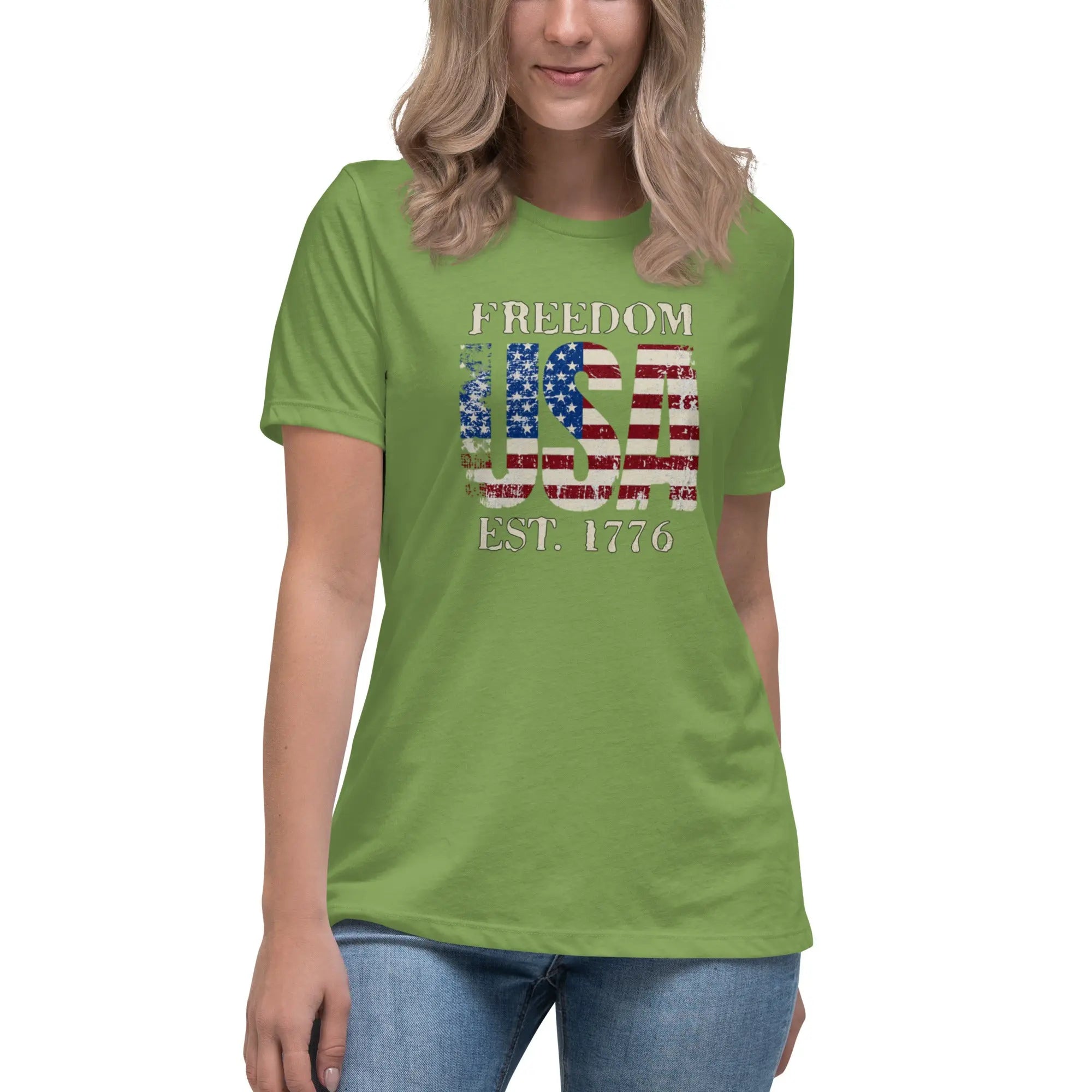 Back of woman wearing a leaf green patriotic t-shirt with  "Freedom USA Est. 1776" text