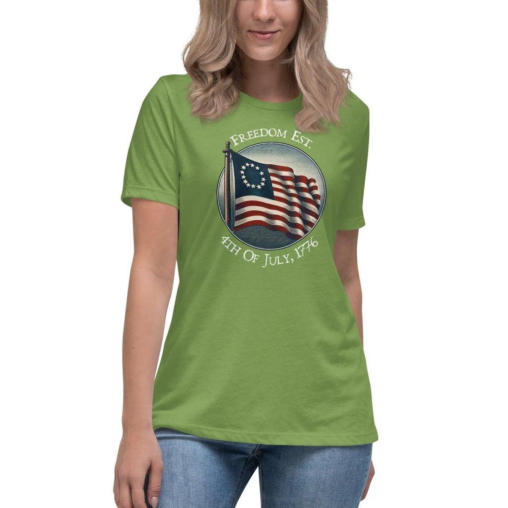 A woman wearing a leaf green patriotic t-shirt with the American flag and the text "Freedom est. 4th of July, 1776."