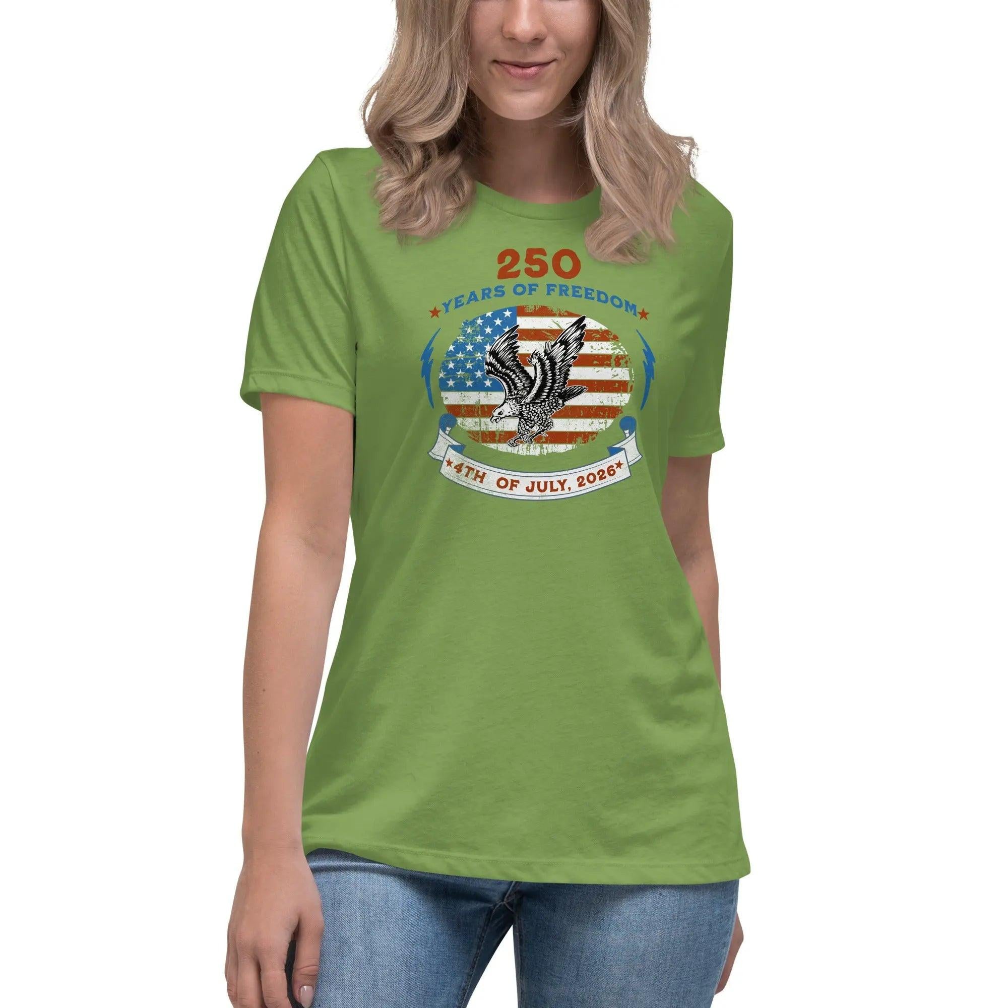 A woman wearing a leaf green patriotic t-shirt with the American flag with a flying eagle over it and the text "250 years of freedom 4th of July, 2026."