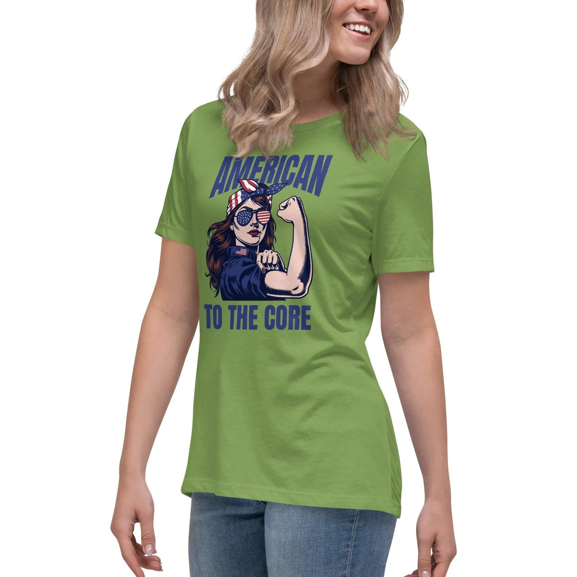 A woman wearing a leaf green, patriotic t-shirt with a strong woman and "American To The Core" text.