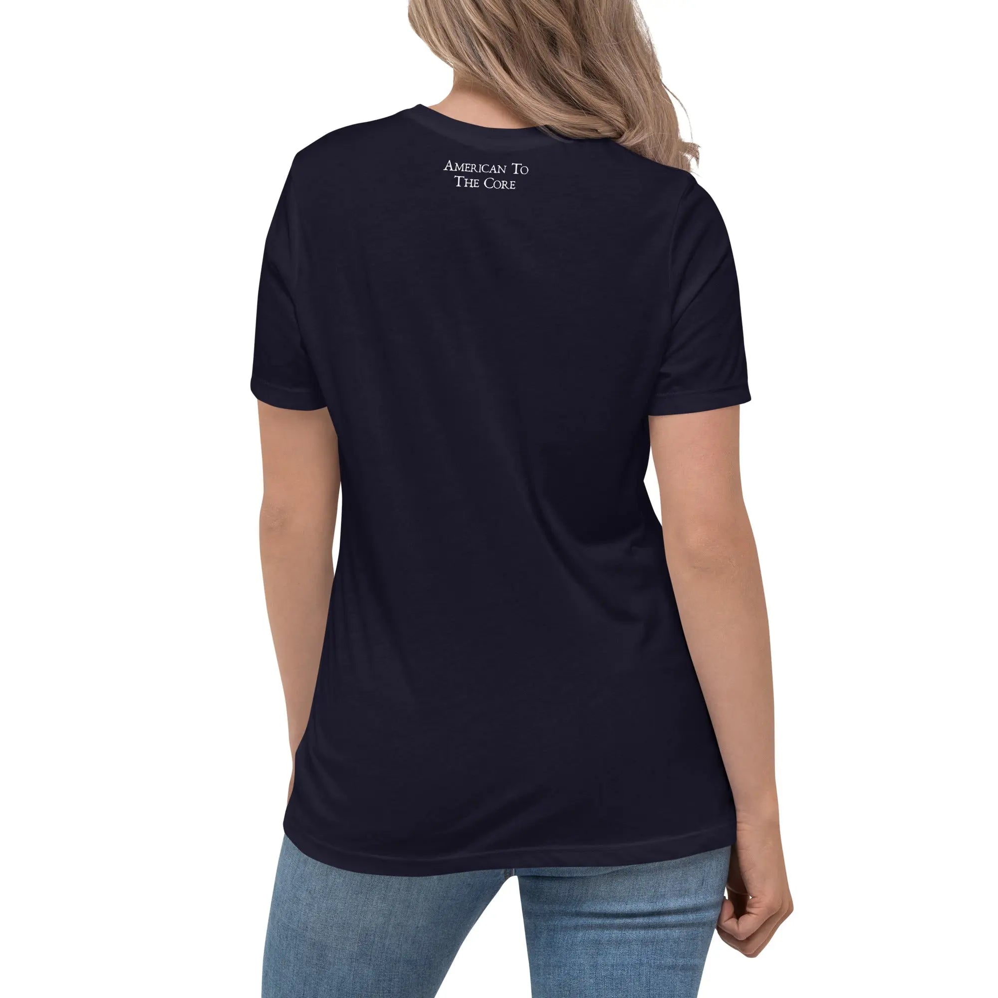 Back of a woman wearing a navy patriotic t-shirt with the text "American To The Core."