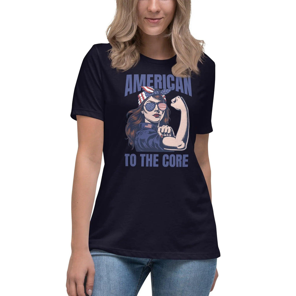 A woman wearing a navy, patriotic t-shirt with a strong woman and "American To The Core" text.