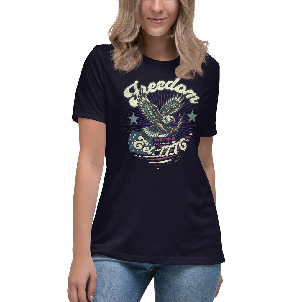 A Woman wearing a navy patriotic t-shirt with an eagle and "Freedom Est. 1776" text.