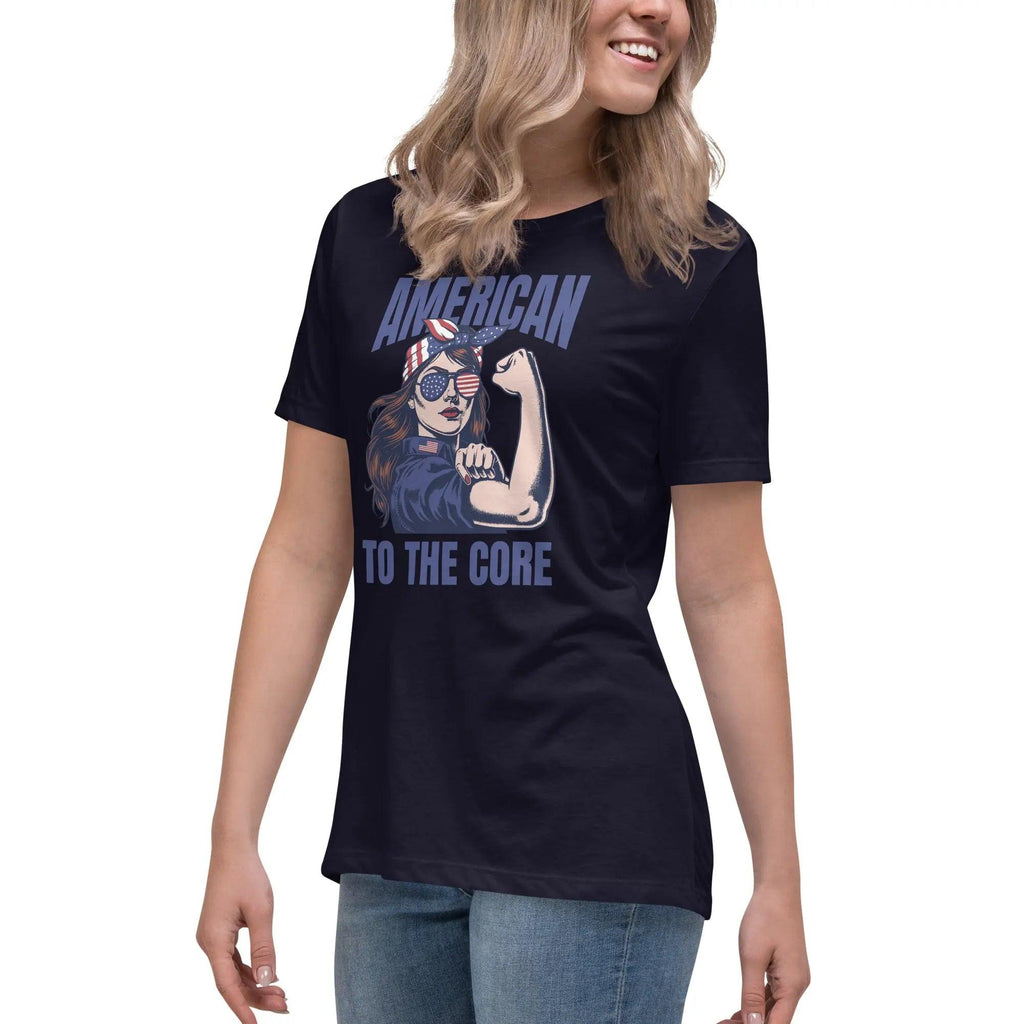 A woman wearing a navy, patriotic t-shirt with a strong woman and "American To The Core" text.