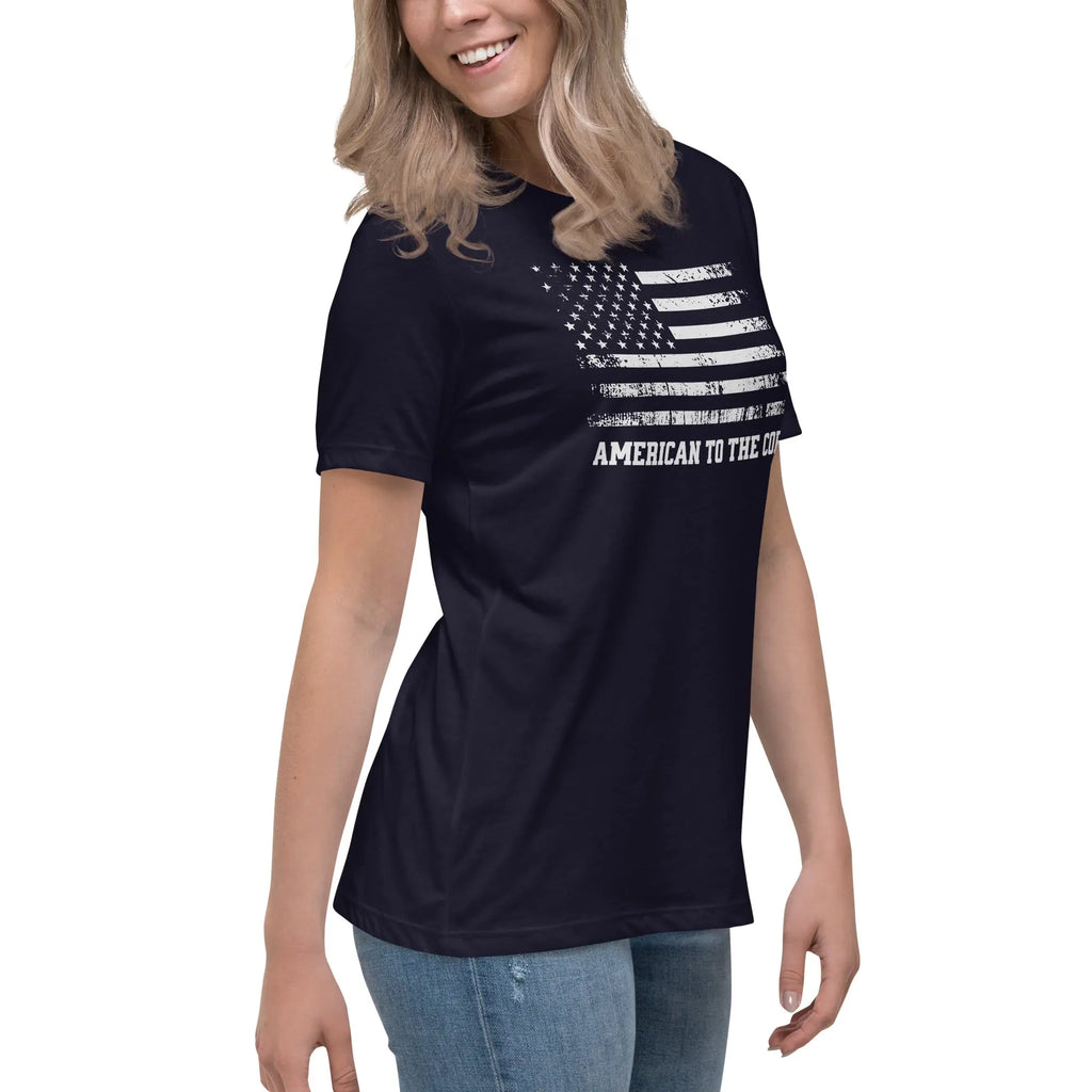 A woman wearing a patriotic navy t-shirt with the American flag in black and white and "American to the core" text