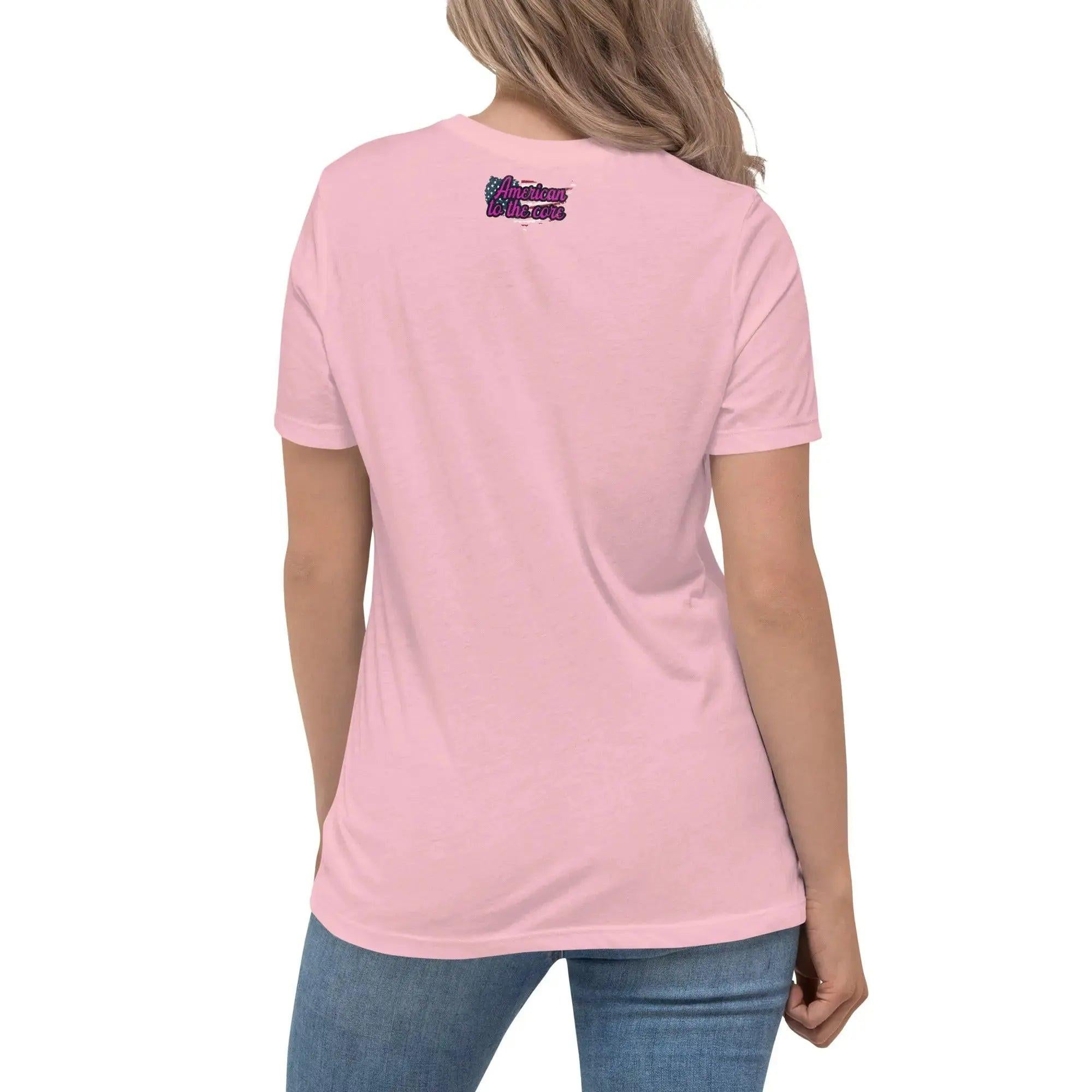 Back of a woman wearing a pink patriotic t-shirt with the text "American To The Core"