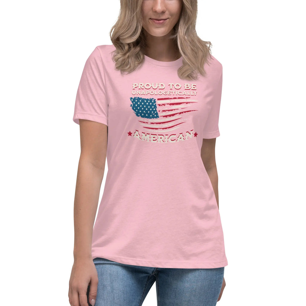 A woman wearing a pink patriotic t-shirt with the American flag and "Proud To Be Unapologetically American" text.