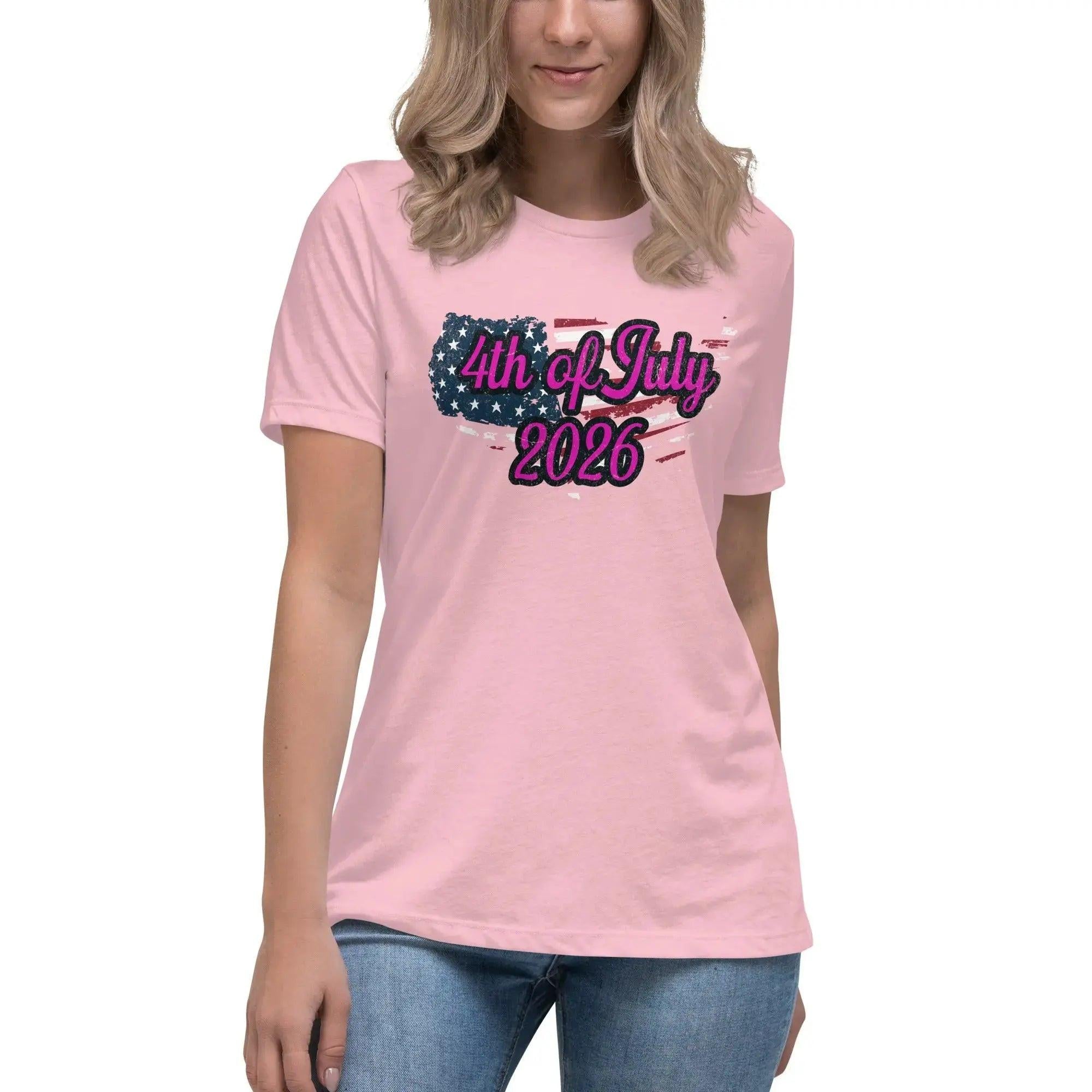 A woman wearing a pink patriotic t-shirt with the American flag in the shape of America and the text "4th of July, 2026."