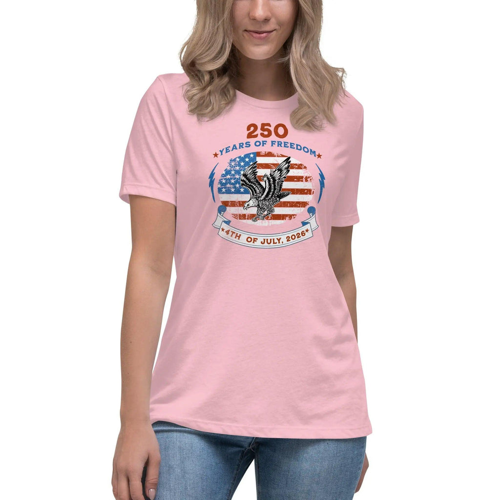 A woman wearing a pink patriotic t-shirt with the American flag with a flying eagle over it and the text "250 years of freedom 4th of July, 2026."