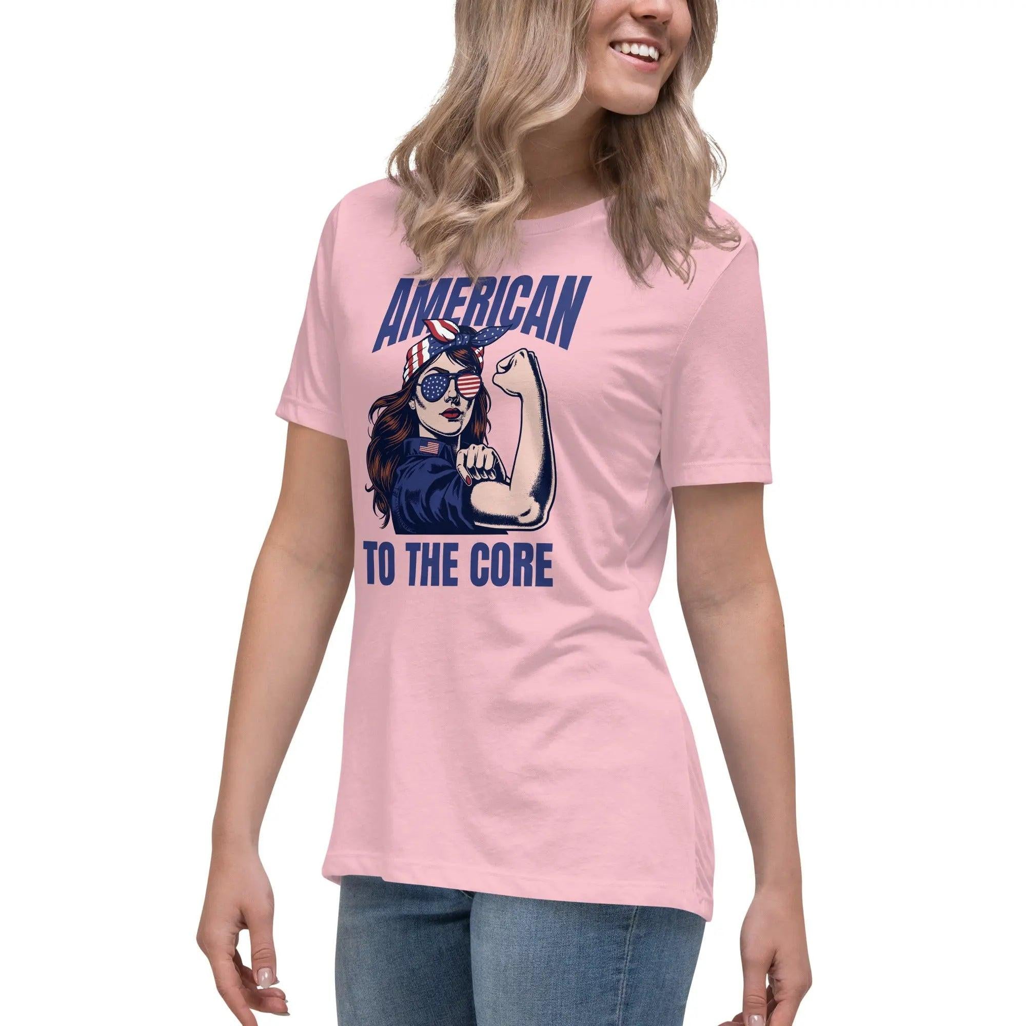A woman wearing a pink, patriotic t-shirt with a strong woman and "American To The Core" text.